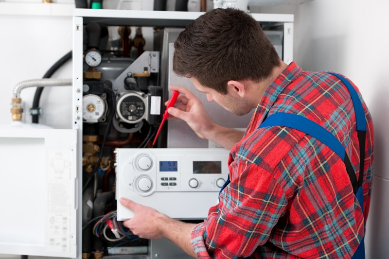 Gas Safe engineer working on a boiler in Wandsworth